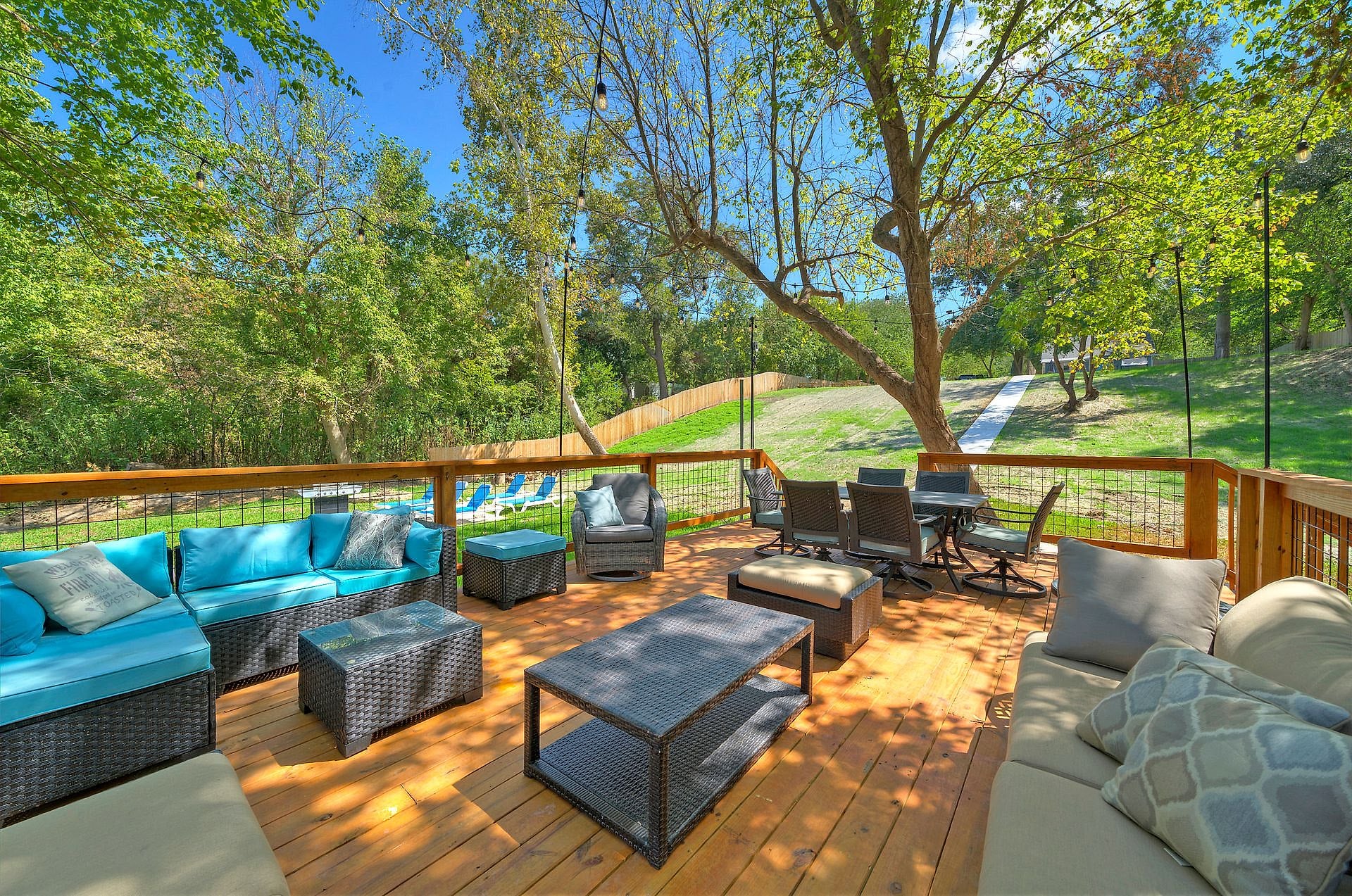 Lounge seating on the river deck above the Colorado River in Cedar Creek