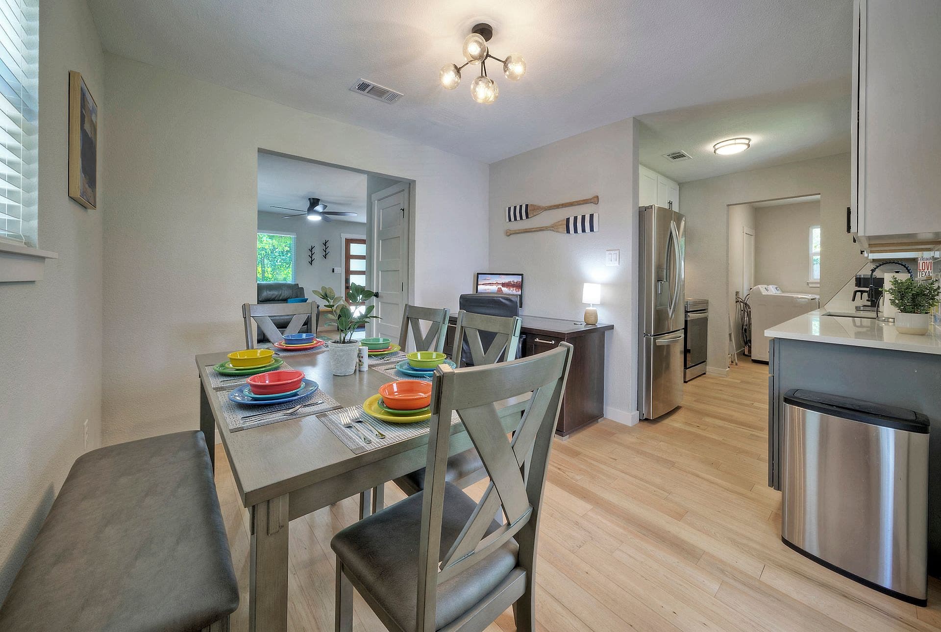 Dining table and renovated kitchen in the River Bend Bliss vacation rental near Austin